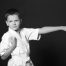 Boy in karate stance in unform